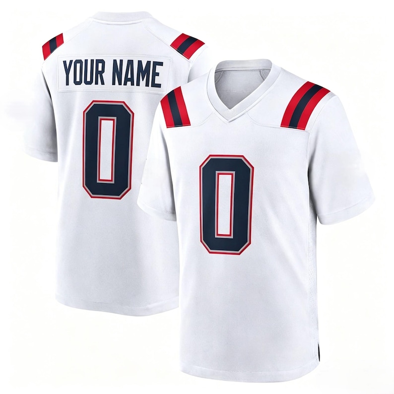 May include: A white short-sleeved jersey featuring a V-neck collar, navy blue and red shoulder stripes, and the number 0 in navy blue with a red outline on the front. The back displays the text YOUR NAME above the navy blue number 0.