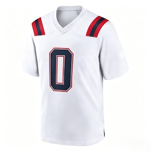 May include: A white short-sleeve jersey with a V-neck collar. The front features a large navy blue number zero with a red and white outline. Each shoulder has two vertical navy blue stripes with a red stripe in the center.