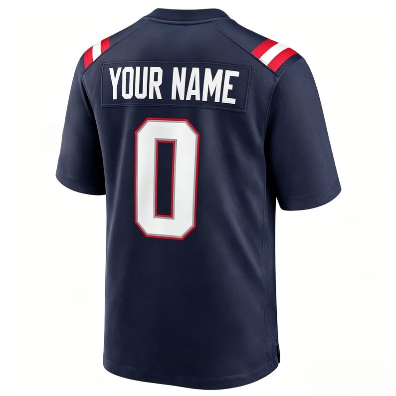 May include: A navy blue short-sleeved sports jersey featuring the text YOUR NAME in white block letters above a large white number 0 with a red and silver outline. The shoulders have red and white stripes on a navy blue background.