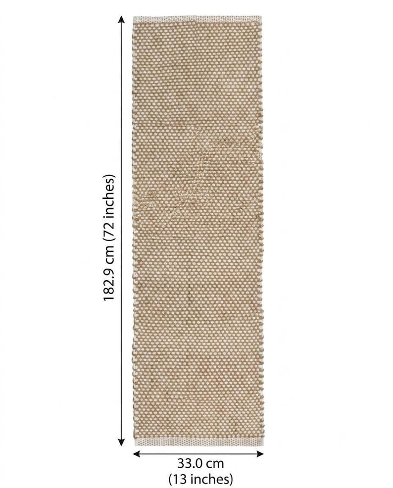 May include: A rectangular woven table runner in a natural tan color with a textured, dotted pattern. The runner measures 182.9 cm (72 inches) in length and 33.0 cm (13 inches) in width, as indicated by the measurement arrows on the image.