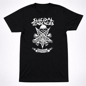 May include: A black short-sleeve t-shirt featuring a white graphic print. The design includes the text SUICIDAL TENDENCIES above a pentagram containing a goat skull, a human skull, and bones. The word POSSESSED is printed on a banner below.