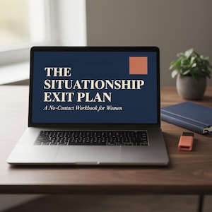 May include: A silver laptop displaying a dark blue screen with the text THE SITUATIONSHIP EXIT PLAN A No-Contact Workbook for Women in cream-colored font and a solid orange square in the upper right corner of the screen display area.