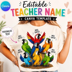 May include: A cream-colored t-shirt featuring a graphic of seven colorful parrots. Each parrot is depicted with its beak open, accompanied by the text "MRS. SMITH!" above or near them. The design includes red, blue, green, and yellow birds.