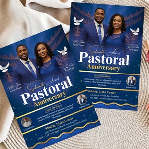 May include: Two identical rectangular flyers for a Sixteenth Annual Pastoral Anniversary event. The blue design features a man and woman, white doves, and text including Shining Light Center, 4567 Harmony Street, Los Angeles, and event details.