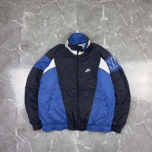 90年代ヴィンテージの黒と白のプーマのウィンドブレーカージャケット