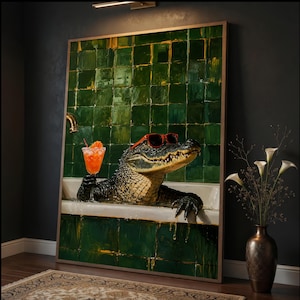 May include: A framed wall art print depicting an alligator wearing red sunglasses while relaxing in a white bathtub against a dark green tiled wall. The alligator holds an orange cocktail with a slice of fruit in its clawed hand.