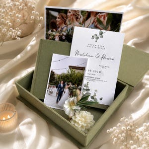 May include: A sage green fabric-covered box containing a wedding invitation with eucalyptus illustrations, the text "Nikahimiza Davetlisiniz", "Neslihan & Hasan", and date "10.2020". Includes two printed photographs of a couple and a white floral candle.