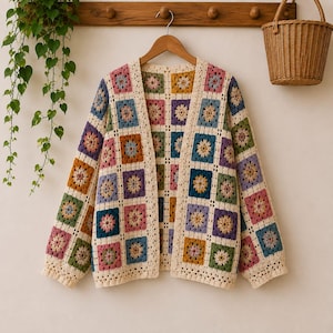 May include: A long-sleeve cardigan made of crocheted granny squares in various colors including pink, blue, yellow, green, and purple, joined by cream-colored yarn. The garment features an open front design with a straight hem and long sleeves.