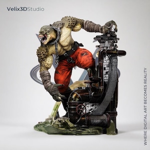 May include: A detailed figurine of a reptilian humanoid creature with textured green skin, sharp teeth, and a metal collar with a chain. The figure wears red pants and stands on a base featuring industrial pipes and brickwork, labeled Velix3DStudio.