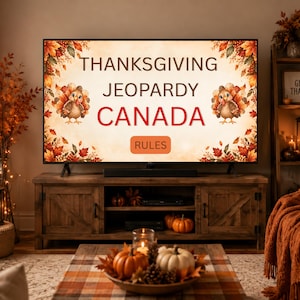 May include: A television screen displaying the text THANKSGIVING JEOPARDY CANADA and RULES, framed by autumn leaves and two cartoon turkeys. The screen is positioned on a wooden media console in a room decorated with pumpkins, candles, and fall foliage.
