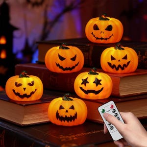 May include: Six orange, glowing, plastic jack-o'-lantern pumpkin lights with various carved facial expressions, including triangular eyes and star-shaped eyes, accompanied by a white rectangular remote control with buttons labeled ON, OFF, 4H, and 8H.