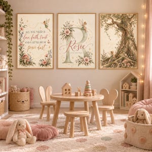 May include: Three framed wall art prints featuring fairy-themed illustrations. The left print displays the text 'All you need is love, faith, trust and a little bit of pixie dust'. The center print features a large letter 'R' with the name 'Rosie'.