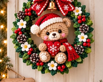 May include: A crocheted Christmas wreath featuring a central teddy bear wearing a Santa hat and scarf, holding a red heart. The wreath is decorated with green leaves, white flowers, red berries, pinecones, a gold bell, and a large red bow.