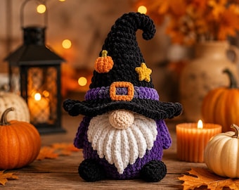 May include: A crocheted gnome figurine wearing a tall black witch hat with a purple band, an orange buckle, a small orange pumpkin, and a yellow star. The gnome has a round beige nose, a long white beard, a purple body, and black feet.