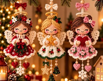 May include: Three crocheted angel ornaments hanging by strings. The left angel wears a red dress with white snowflakes and holds a wreath. The center angel wears a white dress with holly and holds a star. The right angel wears a pink dress with flowers and holds a red heart.