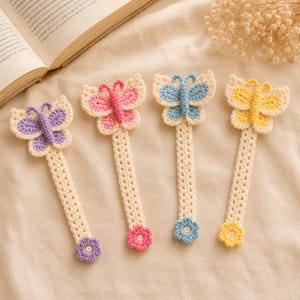 May include: Four handmade crochet bookmarks, each featuring a butterfly at the top and a small flower at the bottom. The butterflies are purple, pink, blue, and yellow, with cream-colored bodies and stems. Each bookmark ends in a matching flower.