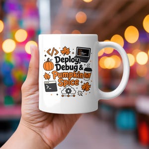 May include: A white ceramic mug featuring a graphic design with the text "Deploy, Debug & Pumpkin Spice". The illustration includes a laptop, a terminal window, a coffee cup, a pumpkin, autumn leaves, and a cloud icon with a gear symbol.