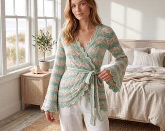 May include: A long-sleeved wrap cardigan featuring a scalloped edge and a tie-waist closure. The knit garment displays a horizontal striped pattern in alternating soft shades of sage green and pale pink, with wide, flared sleeves and a V-neckline.