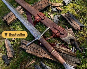 Handgesmeed Elfenlangzwaard: lemmet van Damascusstaal, handvat van walnoothout, accenten van smaragd, zwaard als huwelijksgeschenk