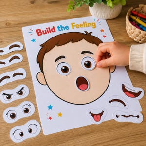 Puede incluir: Una hoja de actividades Build the Feeling que muestra una cara de dibujos animados con cabello castaño y varios rasgos faciales de papel desmontables, incluyendo diferentes expresiones oculares y formas de boca para representar emociones.