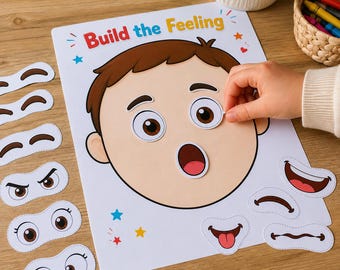 以下が含まれることがあります： Build the Feelingアクティビティシート。茶色の髪の漫画の顔が描かれており、目や口の形をした様々な取り外し可能な紙製のパーツを使って、表情や感情を表現できるようになっています。すべて白い背景に印刷されています。