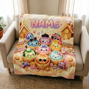 May include: A soft throw blanket featuring a colorful illustration of several cute, anthropomorphic dumplings in bamboo steamers. The design includes the text NAME at the top, gingerbread houses, a disco ball, a boombox, and various snacks.