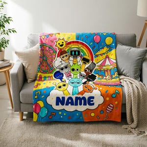 May include: A colorful fleece blanket featuring a carnival theme with a Ferris wheel, carousel, balloons, and a rainbow. A group of cartoon characters is centered above a white cloud shape containing the word NAME in bold blue letters.
