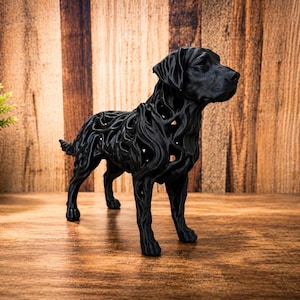 May include: A black dog figurine featuring an intricate, open-work lattice design throughout its body. The sculpture is rendered in a solid matte black finish, capturing the standing posture of a canine with detailed facial features and textured ears.