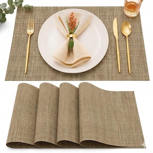 Puede incluir: Un juego de manteles individuales rectangulares, tejidos y de color tostado con un acabado texturizado. Se muestra un mantel con un plato blanco, una servilleta beige con un anillo dorado, un tenedor, un cuchillo y una cuchara dorados.