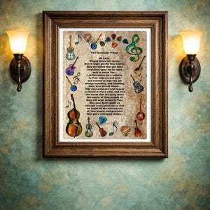May include: A framed print featuring "The Musicians Prayer" with musical instrument illustrations. The brown wooden frame surrounds the text and colorful drawings of guitars, violins, and musical notes. The print is mounted on a textured, teal-colored wall.