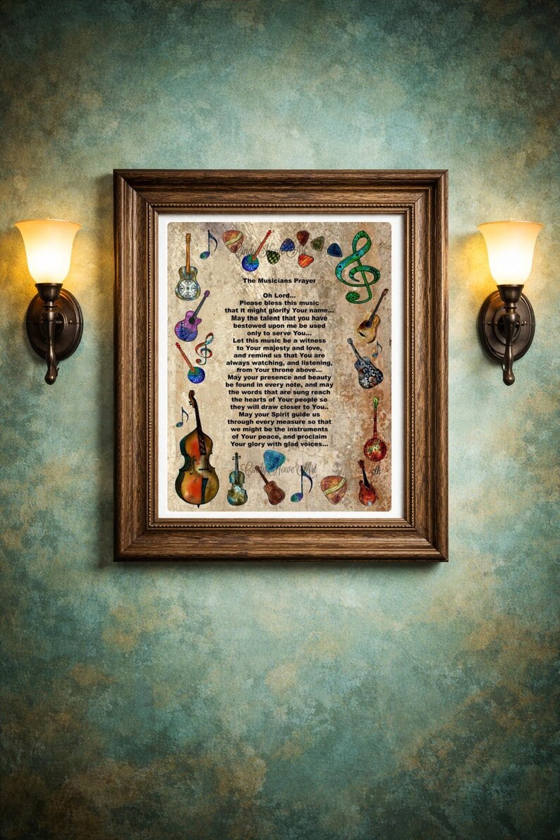 May include: A framed print featuring "The Musicians Prayer" with musical instrument illustrations. The brown wooden frame surrounds the text and colorful drawings of guitars, violins, and musical notes. The print is mounted on a textured, teal-colored wall.