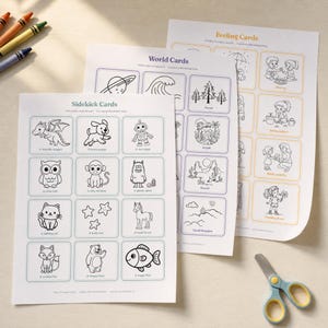 Three printed story prompt card sheets - Sidekick Cards, World Cards, and Feeling Cards - fanned out on a table with scissors and crayons, showing all 36 printable story starter cards in the AiWhizzkids deck.