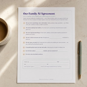 Printed Family AI Agreement page on a kitchen counter beside a coffee mug and pen, ready to fill in and sign