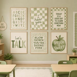 May include: A set of six framed wall art prints in shades of sage green and cream. The prints feature an alphabet, a checkered pattern with the text 'I hear you', inspirational quotes, and a green apple illustration with the text 'SPEECH IS SWEET'.