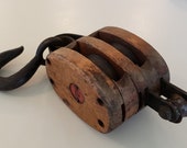Antique Double Wooden Hook and Rope Barn Pulley Made From Cast Iron And Hard Wood With A Cast Iron Wheel