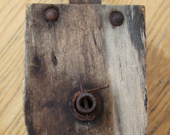 Antique Rope Pulley Made From Cast Iron And Hard Wood