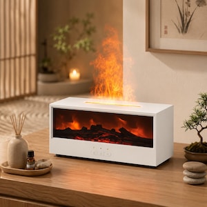 Peut inclure: Un diffuseur d'arômes électrique blanc de forme rectangulaire présentant un affichage de cheminée simulé avec des flammes orange lumineuses et des bûches sombres derrière un panneau avant transparent. Il possède trois boutons de contrôle.