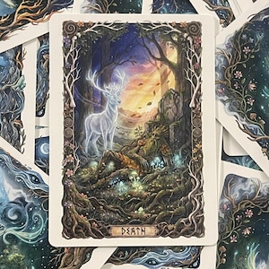 May include: A rectangular tarot card titled DEATH featuring a detailed illustration of a reclining forest figure surrounded by glowing mushrooms and roots, with a translucent white stag standing nearby in a dark, wooded landscape with a sunset sky.