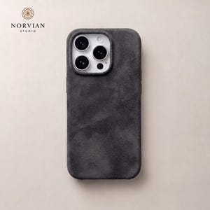 Charcoal gray Alcantara style MagSafe iPhone case with soft suede texture and slim protective fit