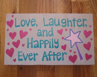 Wooden Wall Art painted with quote "Love, Laughter, and Happily Ever After"