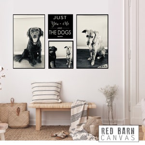 May include: Black and white photo collage featuring three dogs and the text "Just You + Me and The Dogs". The photos are framed in black and hung on a white wall.