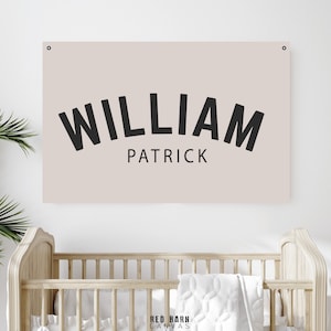 May include: A beige canvas print with black text that reads "WILLIAM PATRICK" in a curved, bold font.