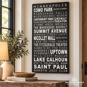Puede incluir: Un lienzo rectangular negro para pared con texto blanco que enumera varios puntos de interés de Minneapolis y Saint Paul, incluyendo Como Park, Mississippi River, Summit Avenue, Nicollet Mall, Uptown y Lake Calhoun en fuente negrita.