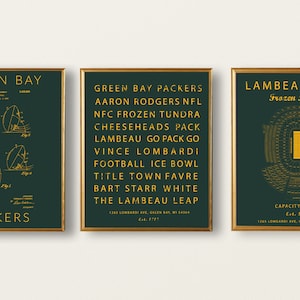 May include: Three framed prints with a green background and gold text. The first print features a diagram of a football with the text "Green Bay Packers". The second print features a list of phrases related to the Green Bay Packers, including "Aaron Rodgers NFL", "NFC Frozen Tundra", and "The Lambeau Leap". The third print features a diagram of Lambeau Field with the text "Lambeau Field Frozen Tundra".
