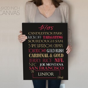 May include: A black canvas print with gold and red text. The text reads "49ers", "Candlestick Park", "Kickoff Tailgating", "Sourdough Sam", "5 Time Superbowl Champs", "Touchdown Gold Rush", "Cardinal & Gold", "Jerry Rice NFL", "NFC Joe Montana", "San Francisco", "The Linfor Family".