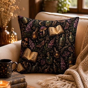 May include: A square throw pillow featuring a black background with a repeating pattern of open books, glass potion bottles, purple foxglove flowers, mushrooms, moths, and crescent moons in shades of gold, green, and purple.