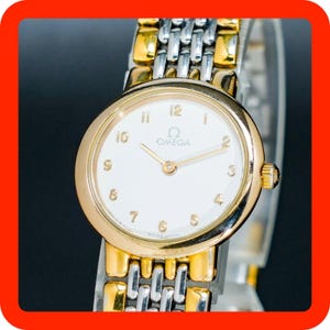 Read Vintage1991 Omega De Ville 795.0897 Gold White Round Quartz Women Watch