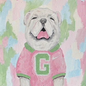 May include: An oil painting of a white bulldog with a pink tongue, wearing a pink shirt with a green collar and a large green letter G on the chest. The background features a textured, abstract pattern of blended pastel pink, green, and blue paint strokes.
