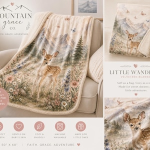 May include: A 50 inch by 60 inch velveteen blanket featuring a printed scene of a fawn standing in a meadow with wildflowers, pine trees, and mountains in the background. The blanket has a cream-colored sherpa-style backing and butterflies.
