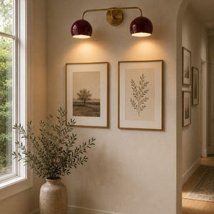 burgundy wall sconce
double wall sconce
brass vanity light
modern wall fixture
dual arm wall light
bathroom wall light
mid century light
burgundy sconce
vanity light brass
minimalist light
wall light fixture
home decor light
luxury wall light
burgundy wall sconce, double wall light, brass wall sconce, vanity wall light, modern wall lamp, bathroom lighting, dome shade light, 2 light sconce, minimal wall light, bedside wall lamp, contemporary light, wall sconce brass, vanity light fixture